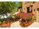 Inviting walkway leads to the front door surrounded by lush landscaping at 103 Windhover Dr, Chapel Hill, NC 27514