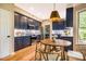 Kitchen features a breakfast nook, wood floors, and stainless appliances at 103 Windhover Dr, Chapel Hill, NC 27514
