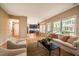 Open living space with views to kitchen/dining areas and large windows providing natural light at 103 Windhover Dr, Chapel Hill, NC 27514