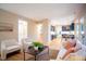 Bright living room showcases seamless flow to kitchen and dining area; large windows offer great light at 103 Windhover Dr, Chapel Hill, NC 27514
