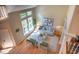 Sun-drenched living room with high ceilings, large windows, and stylish decor, creating a welcoming space at 103 Windhover Dr, Chapel Hill, NC 27514