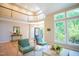 Bright living room with a high ceiling, large windows and hardwood floors at 103 Windhover Dr, Chapel Hill, NC 27514