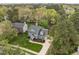 Beautiful two-story home with manicured lawn and landscaping, complemented by mature trees at 104 Dallavia Ct, Morrisville, NC 27560