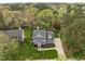 A lush, green lawn surrounds this stunning two-story residence, complete with mature trees at 104 Dallavia Ct, Morrisville, NC 27560