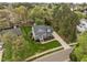 Expansive two-story home with a meticulously landscaped yard, complemented by mature trees and an extra long driveway at 104 Dallavia Ct, Morrisville, NC 27560