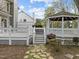 Landscaped backyard with a gazebo and deck area, excellent for outdoor entertaining at 104 Dallavia Ct, Morrisville, NC 27560