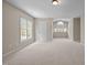 Open bedroom with abundant natural light and a neutral color palette at 104 Dallavia Ct, Morrisville, NC 27560