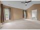 Expansive bedroom with vaulted ceilings, neutral tones, and multiple windows for ample light at 104 Dallavia Ct, Morrisville, NC 27560