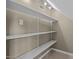 Walk-in closet featuring adjustable white shelving for optimal storage and organization at 104 Dallavia Ct, Morrisville, NC 27560