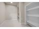 Walk-in closet featuring built-in shelving for ample storage space and organization at 104 Dallavia Ct, Morrisville, NC 27560