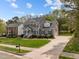 Beautiful two-story home featuring manicured landscaping, a long driveway, and a well-maintained lawn at 104 Dallavia Ct, Morrisville, NC 27560