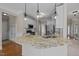 Granite island kitchen features pendant lights, stainless steel appliances and white cabinets at 104 Dallavia Ct, Morrisville, NC 27560