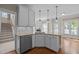 Bright kitchen with white cabinets, stainless steel appliances, and granite countertops at 104 Dallavia Ct, Morrisville, NC 27560