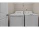 Laundry room with side-by-side washer and dryer, and overhead shelving at 104 Dallavia Ct, Morrisville, NC 27560