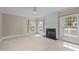 Living room featuring a fireplace, bright windows and neutral finishes at 104 Dallavia Ct, Morrisville, NC 27560