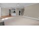 Bright living room with neutral tones, crown molding and an open floor plan at 104 Dallavia Ct, Morrisville, NC 27560