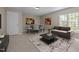Cozy living room with natural light, modern furnishings, and stylish decor at 104 Dallavia Ct, Morrisville, NC 27560