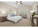 Relaxing bedroom with a vaulted ceiling, neutral tones, and natural light at 109 Homegate Cir, Apex, NC 27502