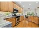 Well-lit kitchen featuring stainless steel appliances and an adjacent breakfast area at 109 Homegate Cir, Apex, NC 27502