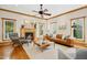 Inviting living room featuring a fireplace, hardwood floors, and a ceiling fan at 109 Homegate Cir, Apex, NC 27502