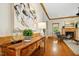 Welcoming living room featuring hardwood floors, a fireplace, and natural light at 109 Homegate Cir, Apex, NC 27502