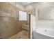 Elegant bathroom with a glass-enclosed shower and a soaking tub at 109 Homegate Cir, Apex, NC 27502