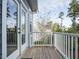 Charming balcony with white railings, offering a peaceful spot with views of surrounding greenery at 110 Streamside Dr, Sanford, NC 27330