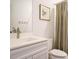 A bathroom with a white vanity and minimalist design at 110 Streamside Dr, Sanford, NC 27330