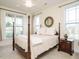 A bedroom with a four-poster bed and classic furnishings at 110 Streamside Dr, Sanford, NC 27330