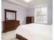 A bedroom featuring a large window, and traditional-style furniture at 110 Streamside Dr, Sanford, NC 27330