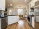 Kitchen with granite counters, stainless appliances, and hardwood floors at 110 Streamside Dr, Sanford, NC 27330