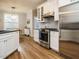 Bright kitchen featuring stainless steel appliances and stylish cabinetry at 110 Streamside Dr, Sanford, NC 27330