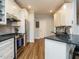 A well-lit kitchen with granite countertops and stainless steel appliances at 110 Streamside Dr, Sanford, NC 27330