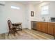 Functional kitchenette with wood cabinets, a stainless steel sink, and a compact refrigerator at 110 Streamside Dr, Sanford, NC 27330