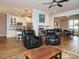Open floor plan features hardwood floors, a modern kitchen, and an inviting dining area at 110 Streamside Dr, Sanford, NC 27330