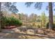 Backyard features a kayak, outdoor dining set, and lovely views of the lake at 111 Fox View Pl, Cary, NC 27511