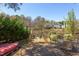 This backyard has a kayak, Adirondack chairs, dining set, and waterfront views at 111 Fox View Pl, Cary, NC 27511