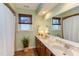 Well-lit bathroom featuring double vanity with granite countertop and decorative accents at 111 Fox View Pl, Cary, NC 27511