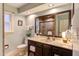 Bathroom with granite counters, vanity and a tiled walk-in shower at 111 Fox View Pl, Cary, NC 27511