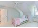 Bedroom featuring vaulted ceiling, twin beds, carpet and dormer window at 111 Fox View Pl, Cary, NC 27511