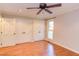Bedroom with hardwood floors, recessed lighting, a ceiling fan and multiple closets at 111 Fox View Pl, Cary, NC 27511