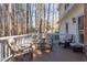 Outdoor deck offering comfortable seating with a wicker seating set and a relaxing view at 111 Fox View Pl, Cary, NC 27511