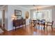 Dining room with hardwood floors, chandelier and bay window looking to the exterior at 111 Fox View Pl, Cary, NC 27511