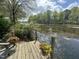 Dock with potted flowers with stunning views of the lake at 111 Fox View Pl, Cary, NC 27511