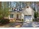 Charming home featuring dormer windows, attached garage, and a manicured lawn at 111 Fox View Pl, Cary, NC 27511