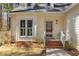 Inviting front porch with brick steps and detailed trim, and stained glass door at 111 Fox View Pl, Cary, NC 27511