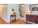 Elegant hallway featuring hardwood floors and classic furnishings, enhanced by soft lighting at 111 Fox View Pl, Cary, NC 27511