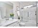 Modern bathroom with a stylish glass-enclosed shower and tub, complemented by a sleek single vanity at 1112 Addington Lake Ln, Knightdale, NC 27545