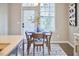 Dining area with a view of the kitchen through the window at 1112 Addington Lake Ln, Knightdale, NC 27545