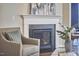 Cozy fireplace with stone surround and a decorative mantel in a comfortably appointed living room at 1112 Addington Lake Ln, Knightdale, NC 27545